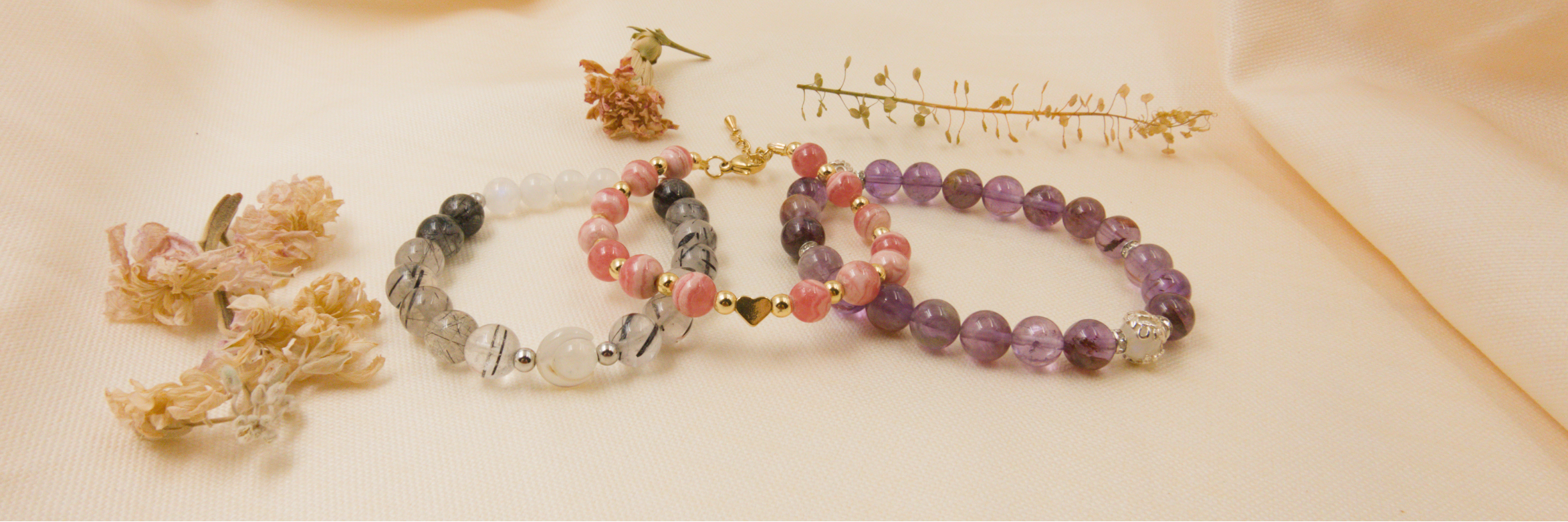 Set of beaded bracelets on a soft beige background