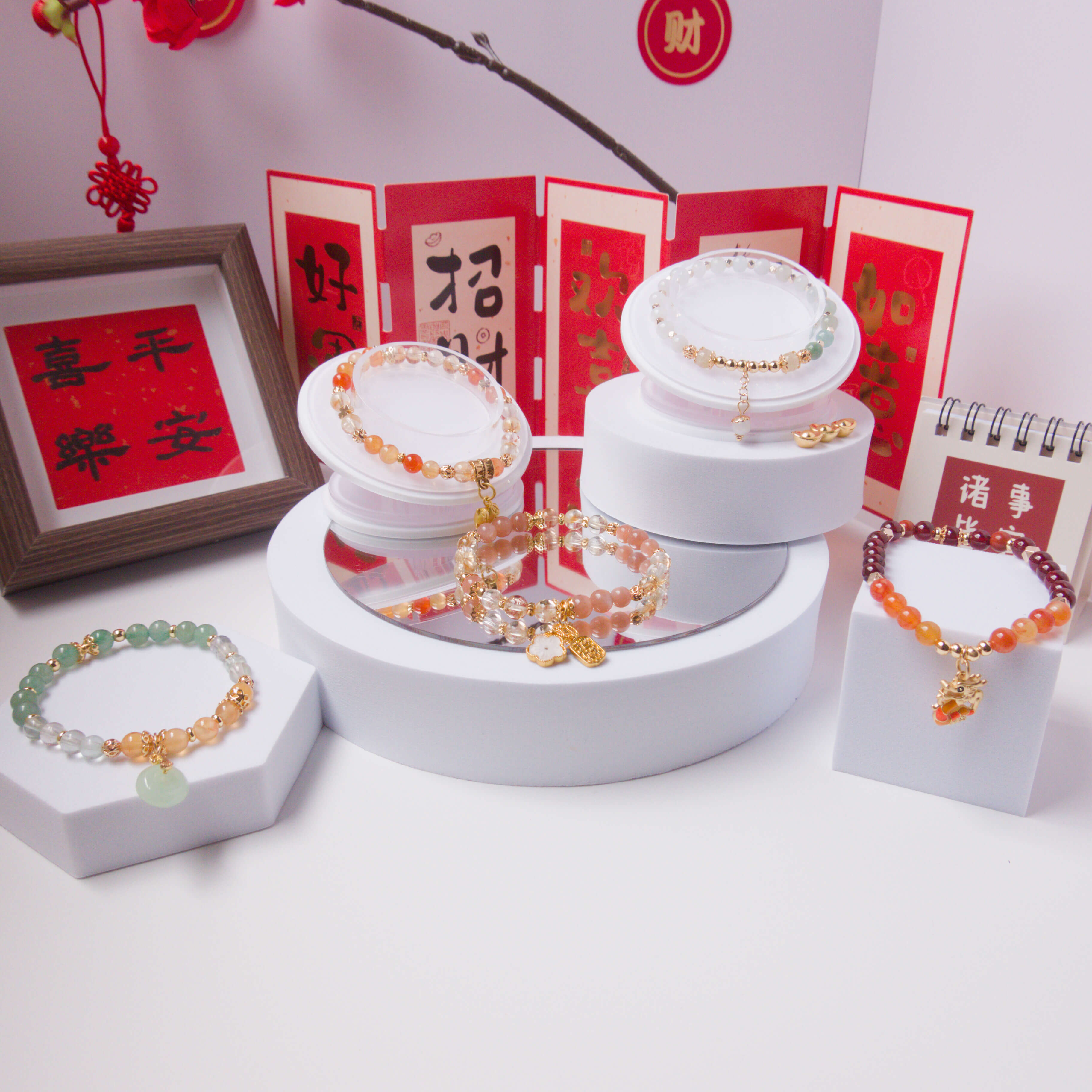 Jewelry display with bracelets on a white stand against a white background